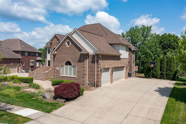 55733 Whitney Ct, Shelby Twp, MI 48315 - traditional-style house with brick siding and driveway