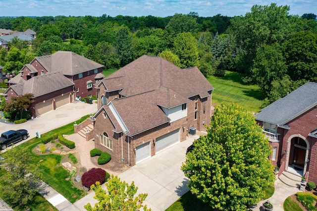 55733 Whitney Ct, Shelby Twp, MI 48315 - aerial view of residential area with a forest
