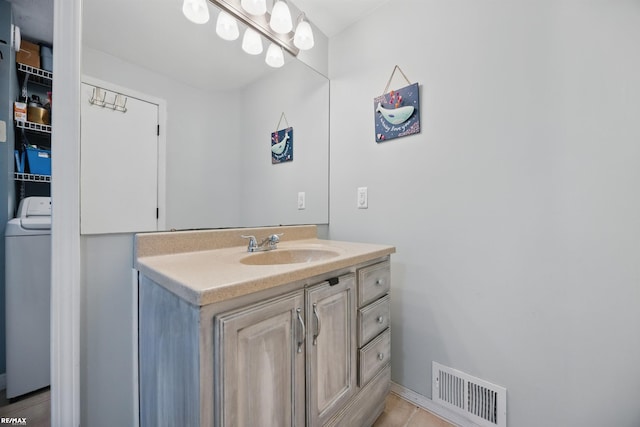 724 Columbia St, Algonac, MI 48001 - bathroom with washer / clothes dryer and vanity