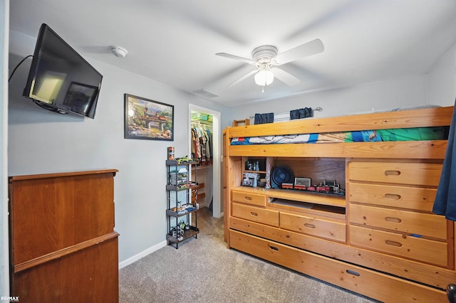 724 Columbia St, Algonac, MI 48001 - carpeted bedroom featuring a walk in closet, baseboards, a closet, and ceiling fan