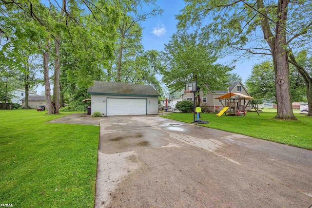 724 Columbia St, Algonac, MI 48001 - view of front of home with a playground, a front lawn, and driveway