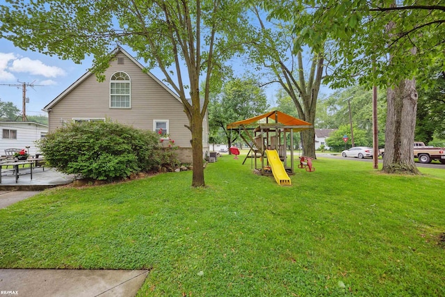 724 Columbia St, Algonac, MI 48001 - view of green lawn featuring a playground and a patio