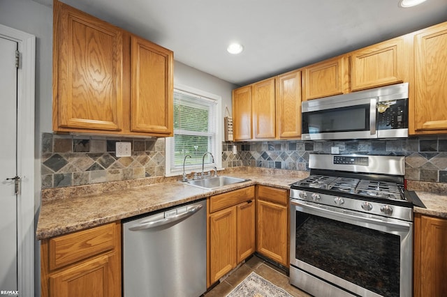 724 Columbia St, Algonac, MI 48001 - kitchen featuring appliances with stainless steel finishes, a sink, tasteful backsplash, recessed lighting, and light countertops