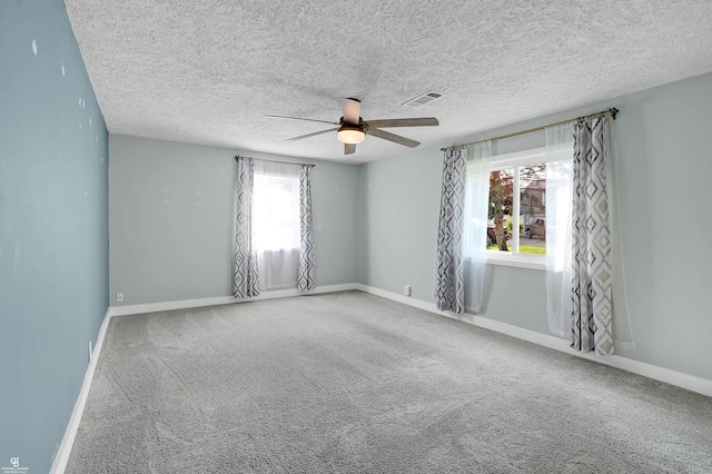 432 Eagle Pass St, Lapeer, MI 48446 - carpeted spare room featuring ceiling fan, baseboards, and a textured ceiling