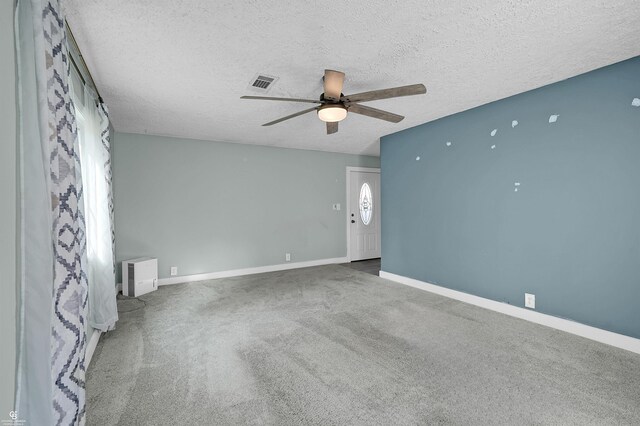 432 Eagle Pass St, Lapeer, MI 48446 - spare room with a ceiling fan, a textured ceiling, baseboards, and carpet floors