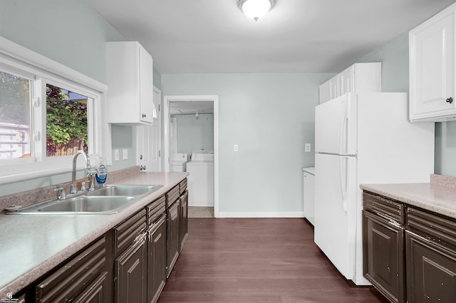 432 Eagle Pass St, Lapeer, MI 48446 - kitchen with a sink, separate washer and dryer, white cabinetry, and light countertops