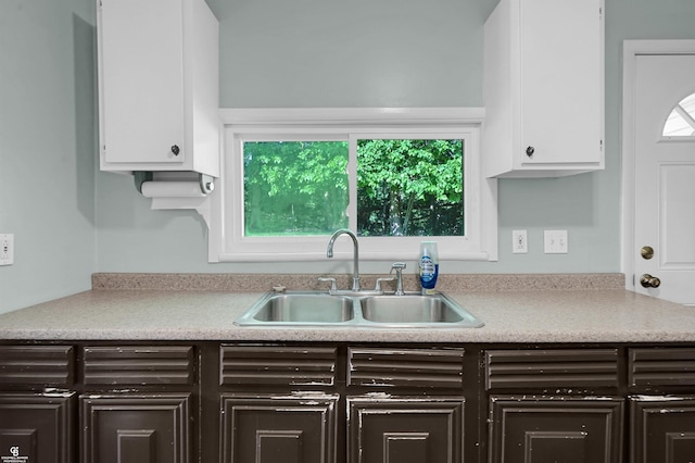 432 Eagle Pass St, Lapeer, MI 48446 - kitchen with a sink, white cabinets, light countertops, and healthy amount of natural light