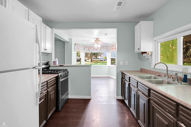 432 Eagle Pass St, Lapeer, MI 48446 - kitchen with freestanding refrigerator, stainless steel gas range oven, a sink, and light countertops