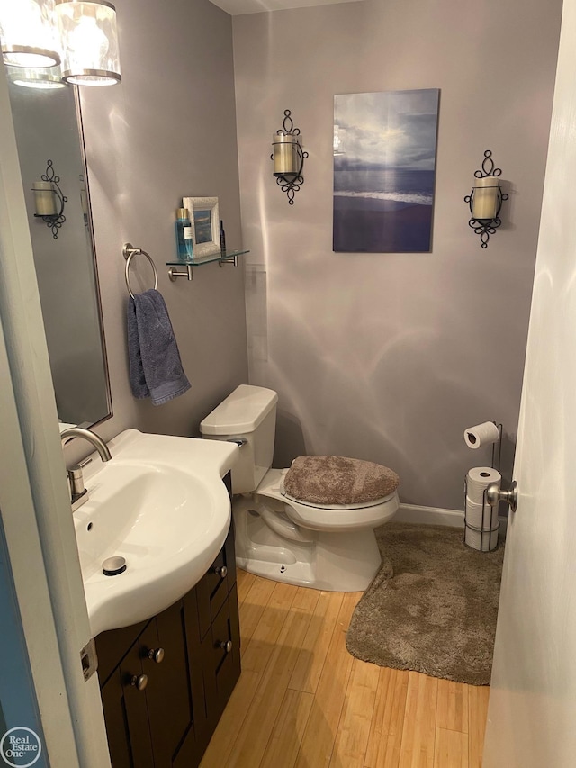44854 Forest Trail Dr, Canton, MI 48187 - bathroom with wood finished floors, toilet, and vanity