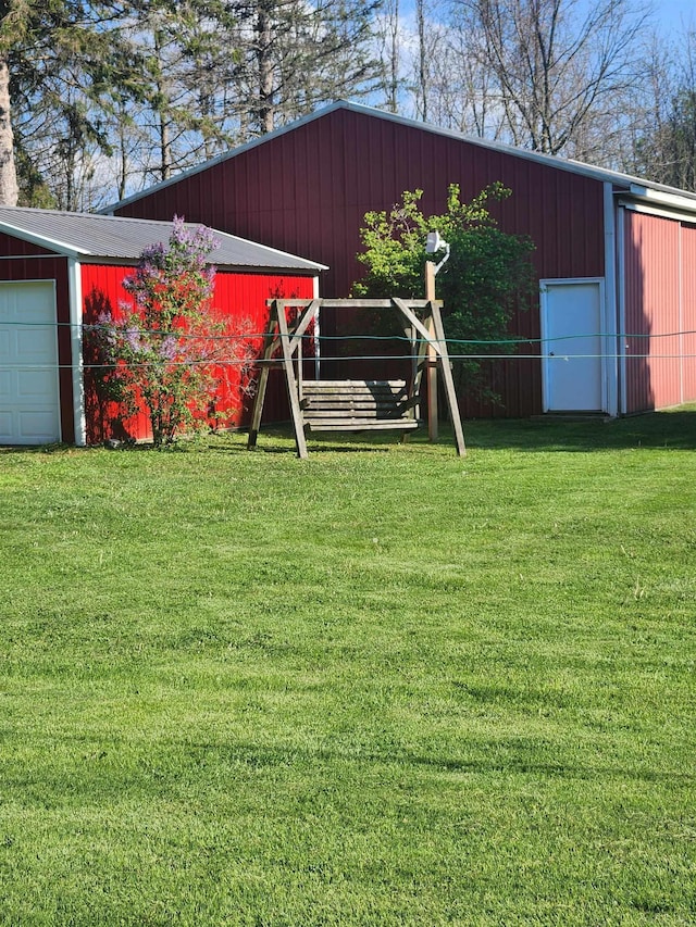 4590 Main St, Applegate, MI 48401 - view of grassy yard with a pole building, an outdoor structure, and a detached garage