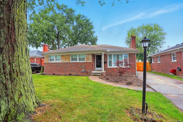 21629 Yale St, Saint Clair Shores, MI 48081 - bungalow-style house with a chimney, brick siding, and driveway