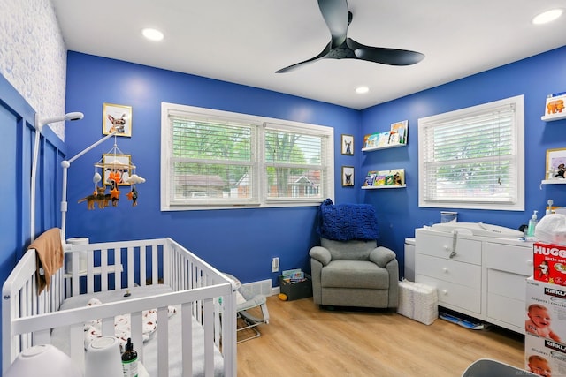 21629 Yale St, Saint Clair Shores, MI 48081 - bedroom with wood finished floors, a nursery area, ceiling fan, recessed lighting, and baseboards