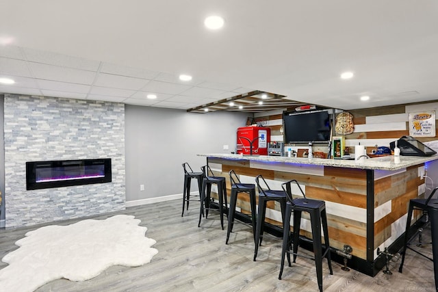 21629 Yale St, Saint Clair Shores, MI 48081 - indoor bar featuring wood finished floors, baseboards, recessed lighting, and a fireplace