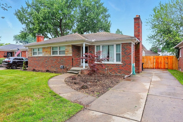 21629 Yale St, Saint Clair Shores, MI 48081 - bungalow featuring a chimney, brick siding, a gate, and a shingled roof