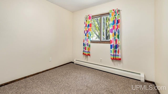 2119 S 21st Ave, Escanaba, MI 49829 - unfurnished room featuring a baseboard radiator, carpet floors, and baseboards