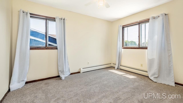 2119 S 21st Ave, Escanaba, MI 49829 - unfurnished room featuring carpet floors, a ceiling fan, and baseboards