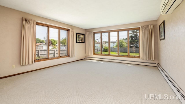 2119 S 21st Ave, Escanaba, MI 49829 - carpeted spare room featuring a wall unit AC and baseboard heating