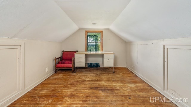 8102 W.5 Rd, Rapid River, MI 49878 - home office with hardwood / wood-style floors, lofted ceiling, and baseboards