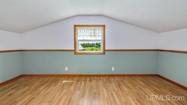 8102 W.5 Rd, Rapid River, MI 49878 - bonus room with wood finished floors, baseboards, and vaulted ceiling