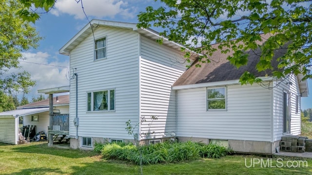 8102 W.5 Rd, Rapid River, MI 49878 - view of property exterior with a lawn
