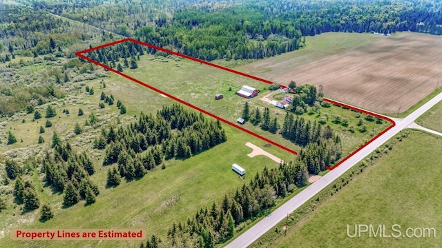 8102 W.5 Rd, Rapid River, MI 49878 - aerial view of sparsely populated area featuring property boundaries highlighted and a forest