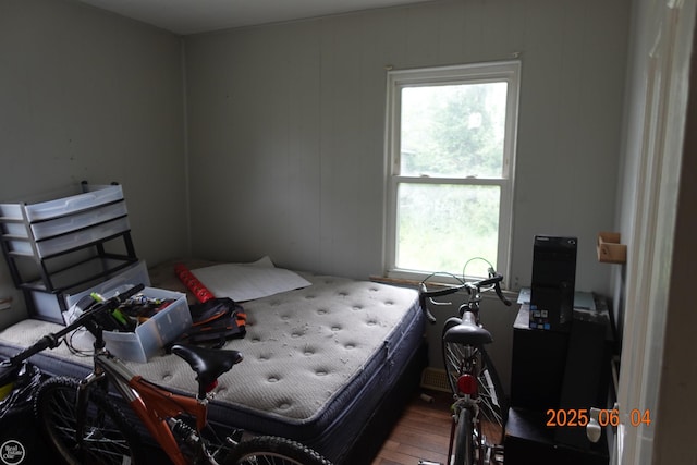 1321 Cornell Rd, Muskegon, MI 49441 - bedroom with multiple windows and wood finished floors