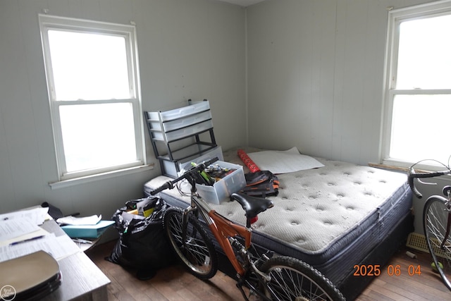 1321 Cornell Rd, Muskegon, MI 49441 - bedroom featuring hardwood / wood-style flooring and multiple windows
