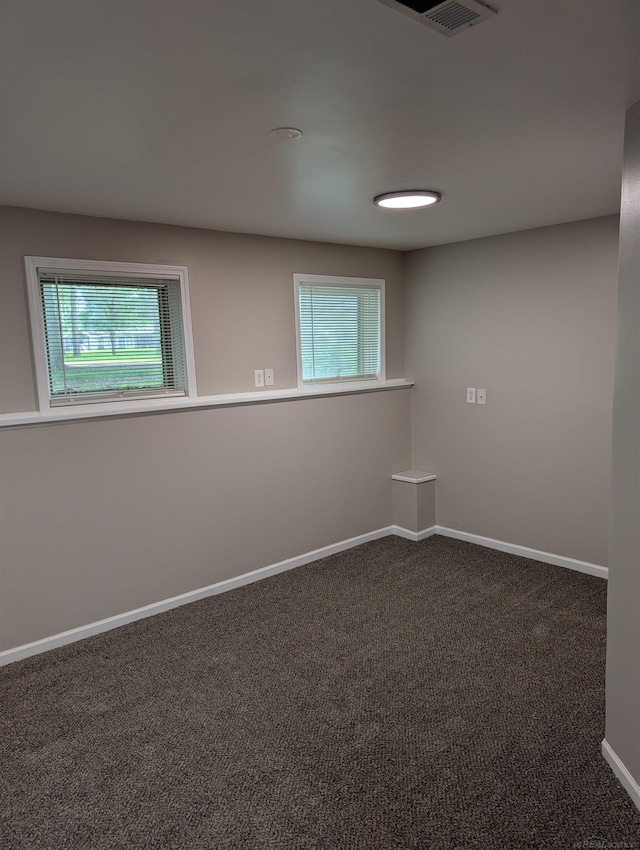 60606 Avendt Dr, New Haven, MI 48048 - empty room featuring plenty of natural light, carpet floors, and baseboards