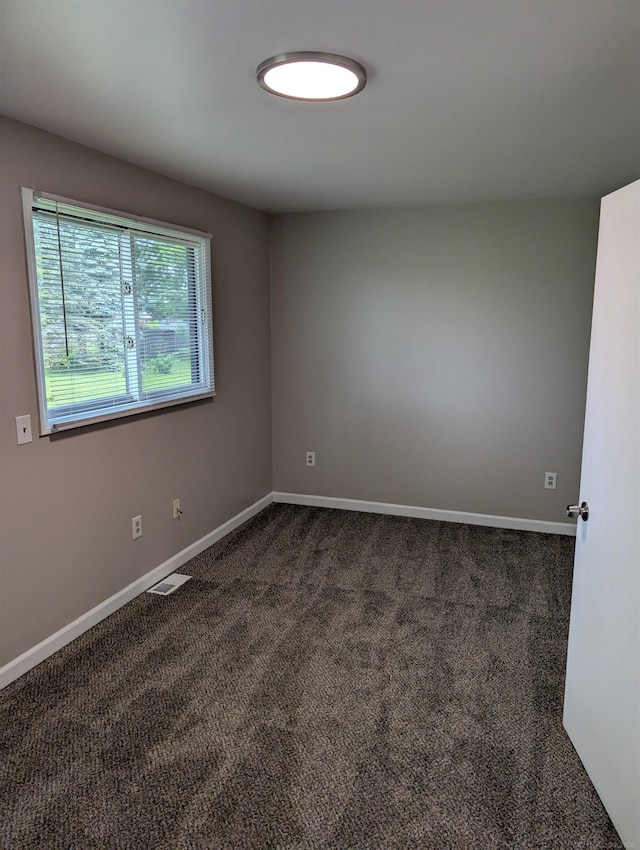 60606 Avendt Dr, New Haven, MI 48048 - unfurnished room featuring dark colored carpet and baseboards