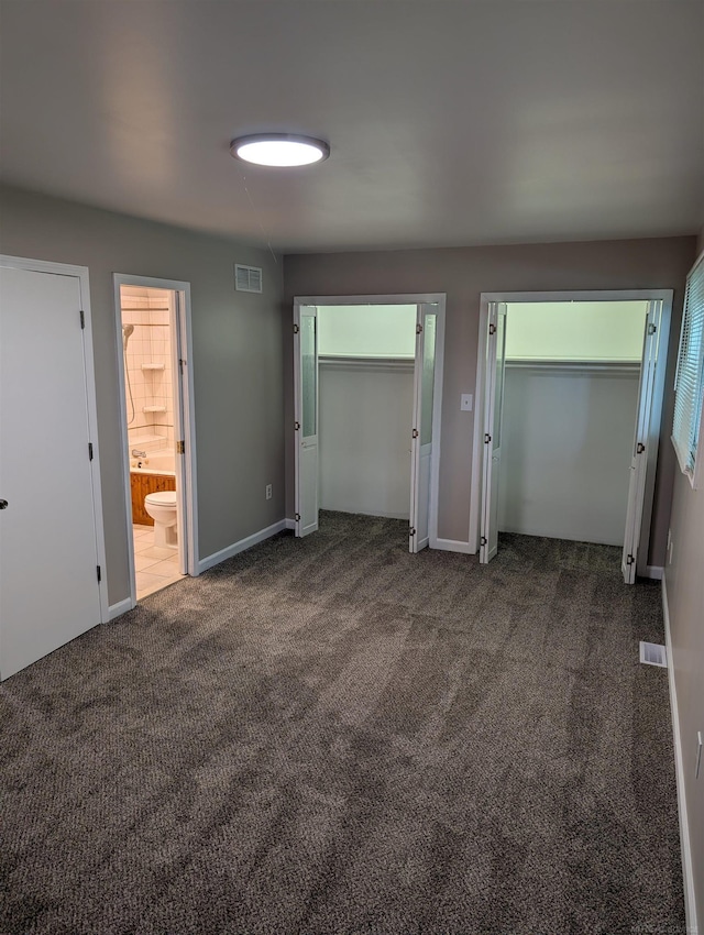60606 Avendt Dr, New Haven, MI 48048 - unfurnished bedroom featuring two closets, carpet floors, baseboards, and ensuite bathroom