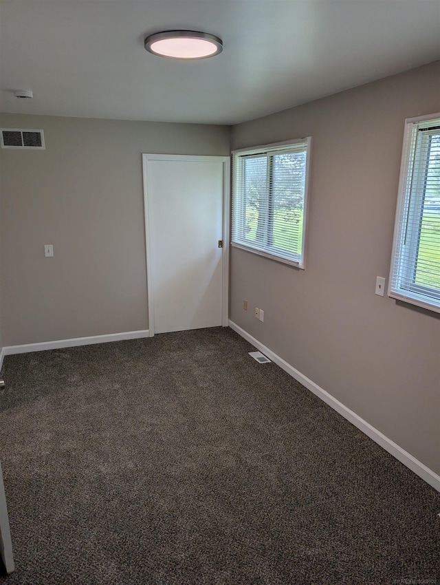 60606 Avendt Dr, New Haven, MI 48048 - unfurnished room featuring baseboards and dark carpet