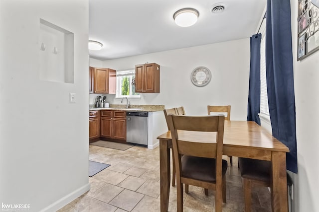 32540 Sutton Rd, Chesterfield, MI 48047 - kitchen featuring stainless steel dishwasher, light countertops, a sink, brown cabinetry, and baseboards