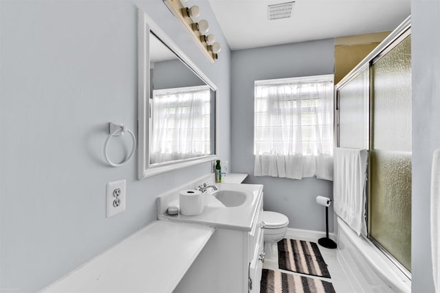 28316 Little Mack Ave, Saint Clair Shores, MI 48081 - bathroom with toilet, vanity, enclosed tub / shower combo, tile patterned floors, and baseboards