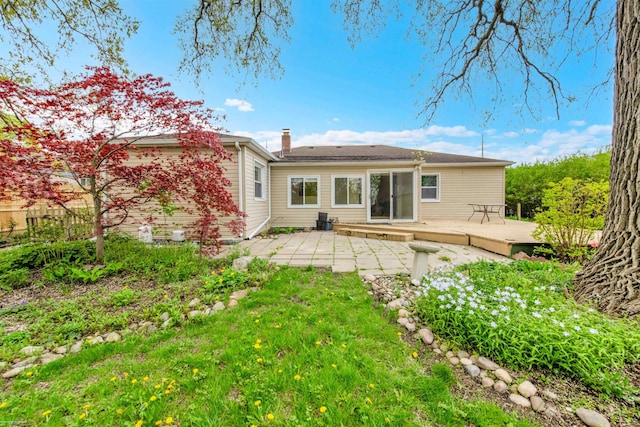 28316 Little Mack Ave, Saint Clair Shores, MI 48081 - rear view of house featuring a wooden deck, a patio area, and a chimney