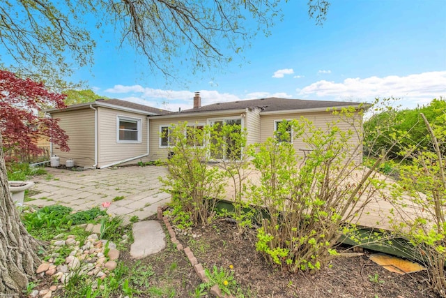 28316 Little Mack Ave, Saint Clair Shores, MI 48081 - back of property featuring a patio and a chimney