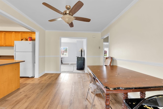28316 Little Mack Ave, Saint Clair Shores, MI 48081 - dining room with light wood-type flooring, ceiling fan, crown molding, and baseboards