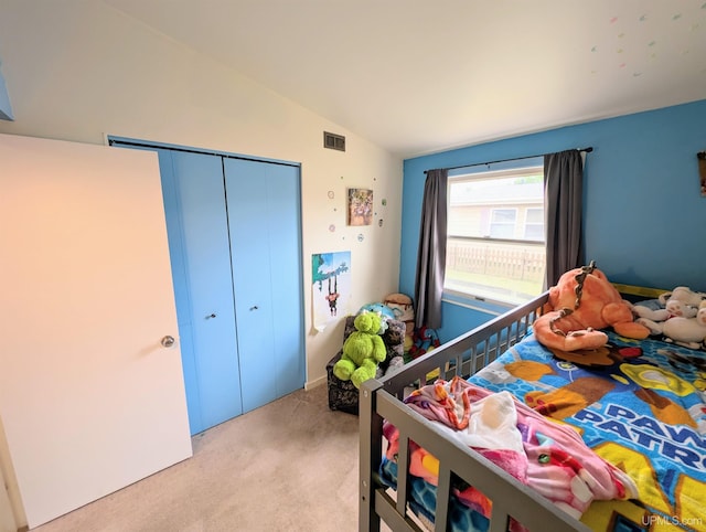 104 Provider St, Gwinn, MI 49841 - bedroom with light colored carpet, vaulted ceiling, and a closet