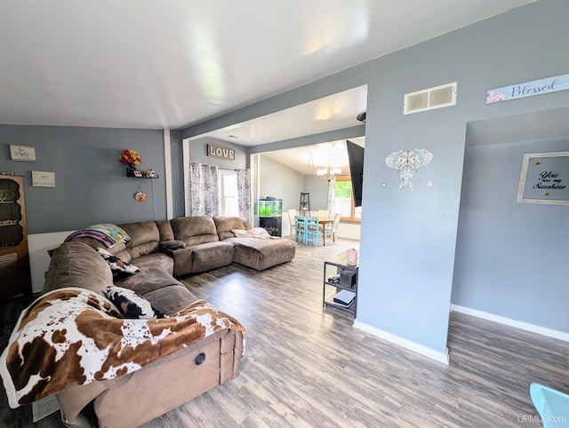 104 Provider St, Gwinn, MI 49841 - living area with a chandelier, wood finished floors, and baseboards
