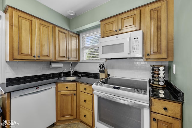 1984 Lancaster St, Grosse Pointe Woods, MI 48236 - kitchen with white appliances, a sink, tasteful backsplash, and brown cabinets