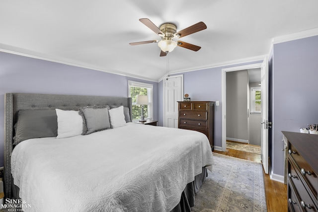 1984 Lancaster St, Grosse Pointe Woods, MI 48236 - bedroom featuring wood finished floors, baseboards, ceiling fan, a closet, and ornamental molding
