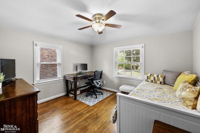 1984 Lancaster St, Grosse Pointe Woods, MI 48236 - bedroom with a desk, baseboards, wood finished floors, and a ceiling fan