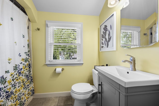 1984 Lancaster St, Grosse Pointe Woods, MI 48236 - full bath with toilet, vanity, baseboards, a shower with shower curtain, and tile patterned floors