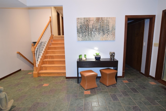 5400 Siebert St, Midland, MI 48640 - dining area featuring baseboards, stone finish flooring, and stairway