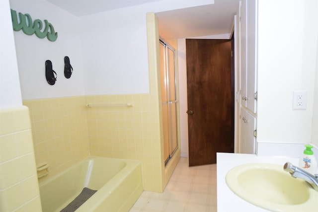 5400 Siebert St, Midland, MI 48640 - full bath featuring a garden tub, a stall shower, tile patterned floors, vanity, and tile walls