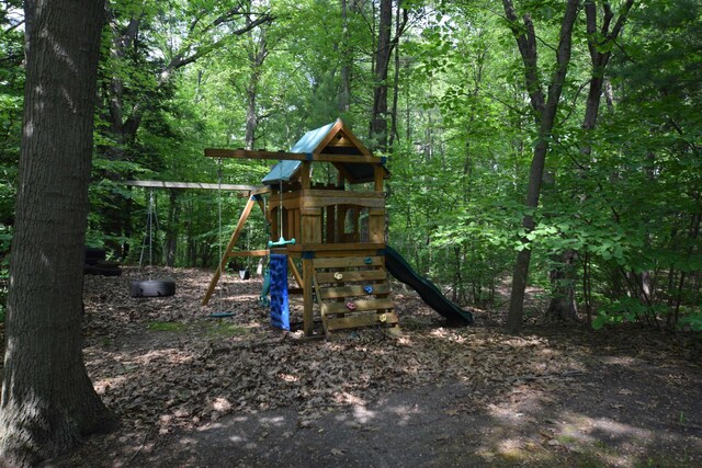 5400 Siebert St, Midland, MI 48640 - view of playground with a wooded view