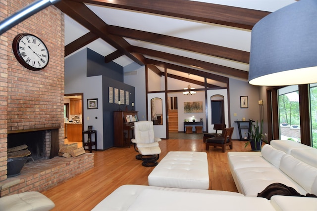 5400 Siebert St, Midland, MI 48640 - living area featuring high vaulted ceiling, a fireplace, wood finished floors, beam ceiling, and arched walkways