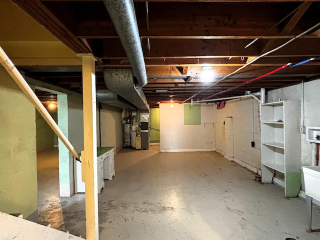 3109 Yale St, Flint, MI 48503 - unfinished below grade area featuring water heater and heating unit