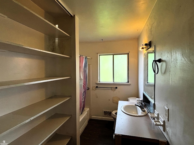 3109 Yale St, Flint, MI 48503 - full bathroom featuring vanity, shower / bath combo with shower curtain, and wood finished floors