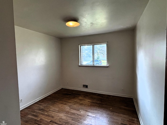 3109 Yale St, Flint, MI 48503 - empty room with dark wood-style floors