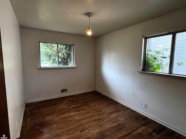 3109 Yale St, Flint, MI 48503 - spare room with dark wood-type flooring and baseboards